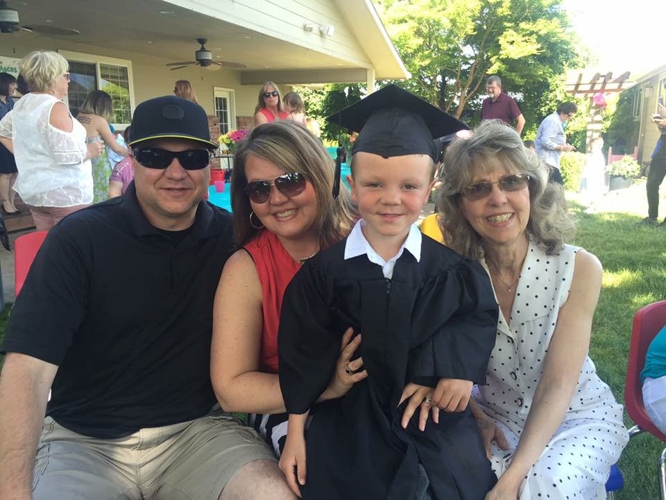 A proud family with their Little VIP kindergarten graduate